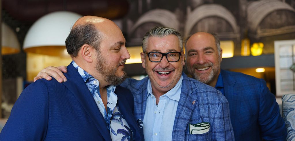 Three men wearing blue from Sid Royale